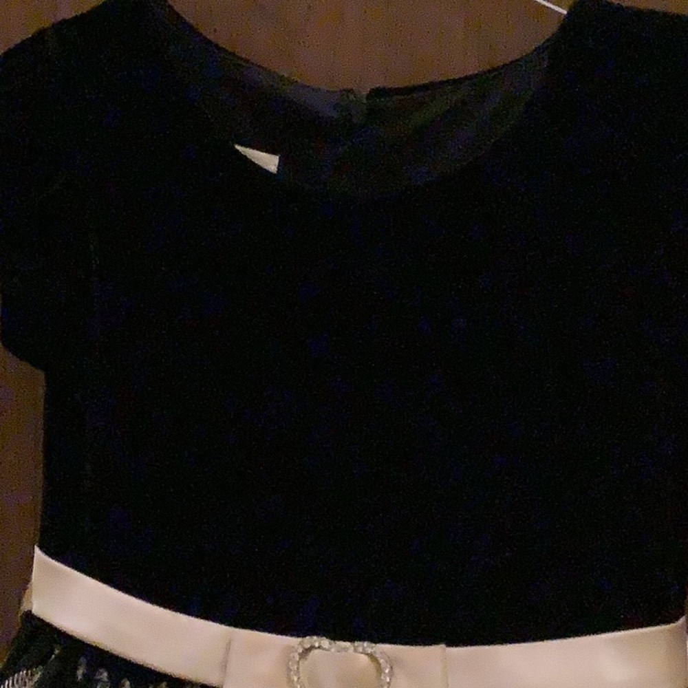 A black and gold leaf design dress